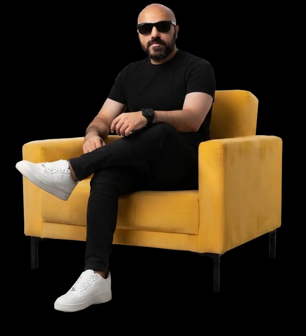 Mazhar Talpur sitting on a yellow armchair